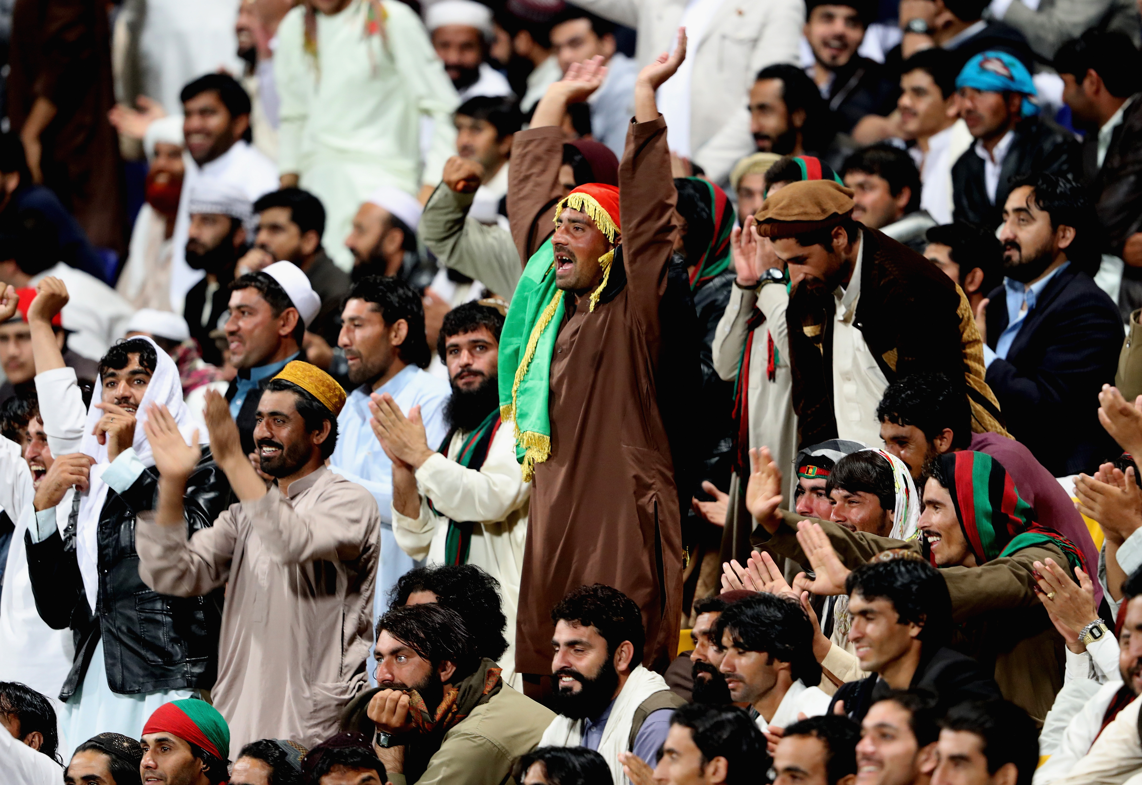 Afghanistan fans cheering for their team during a match 
