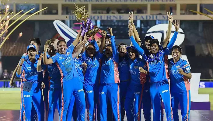 Mumbai Indians with the WPL Season 1 trophy.