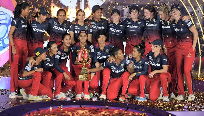 Royal Challengers Bangalore with the WPL 2024 Trophy.