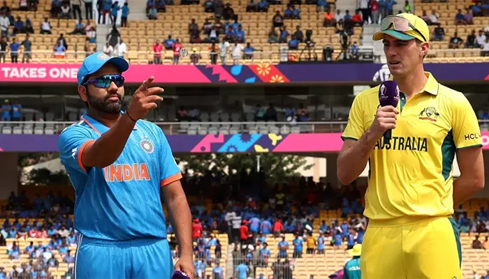 Rohit Sharma and Pat Cummins during the 2023 ODI World Cup Finals toss.